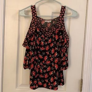 Black blouse with reddish-orange pattern